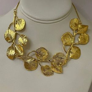 Brand new leaf statement necklace, adjustable, gold color.